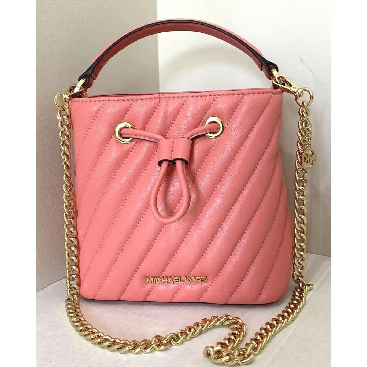 Michael Kors Small Suri Bucket Crossbody Bag Vegan Leather Grapefruit