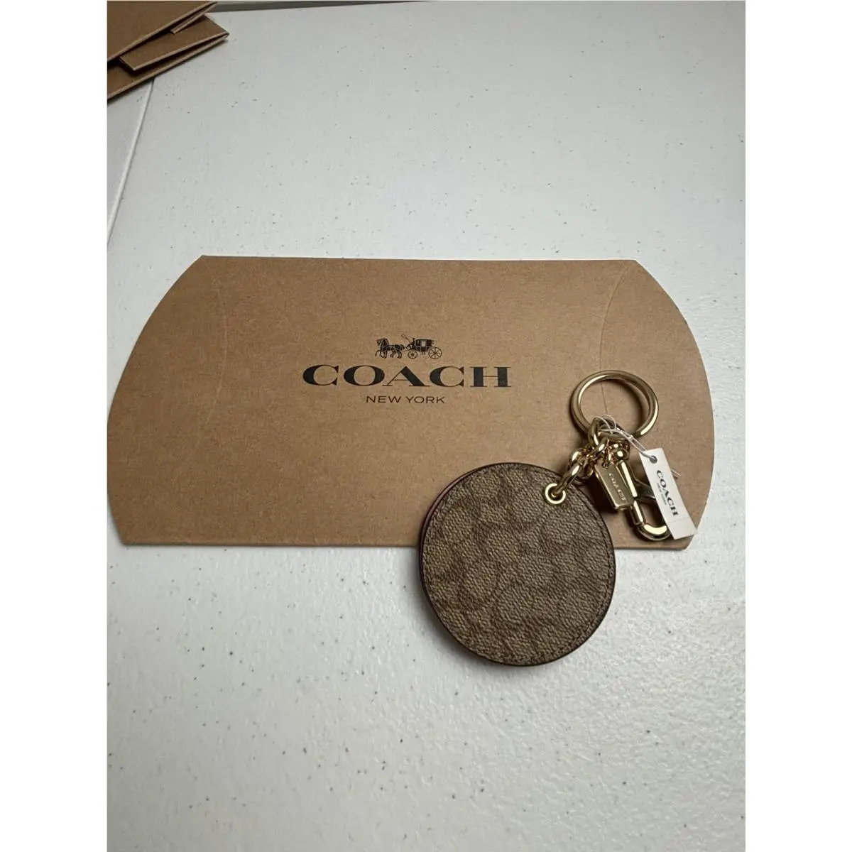 Coach Logo Beigepinkcharm with Mirror Brass Keychain Purse Decor