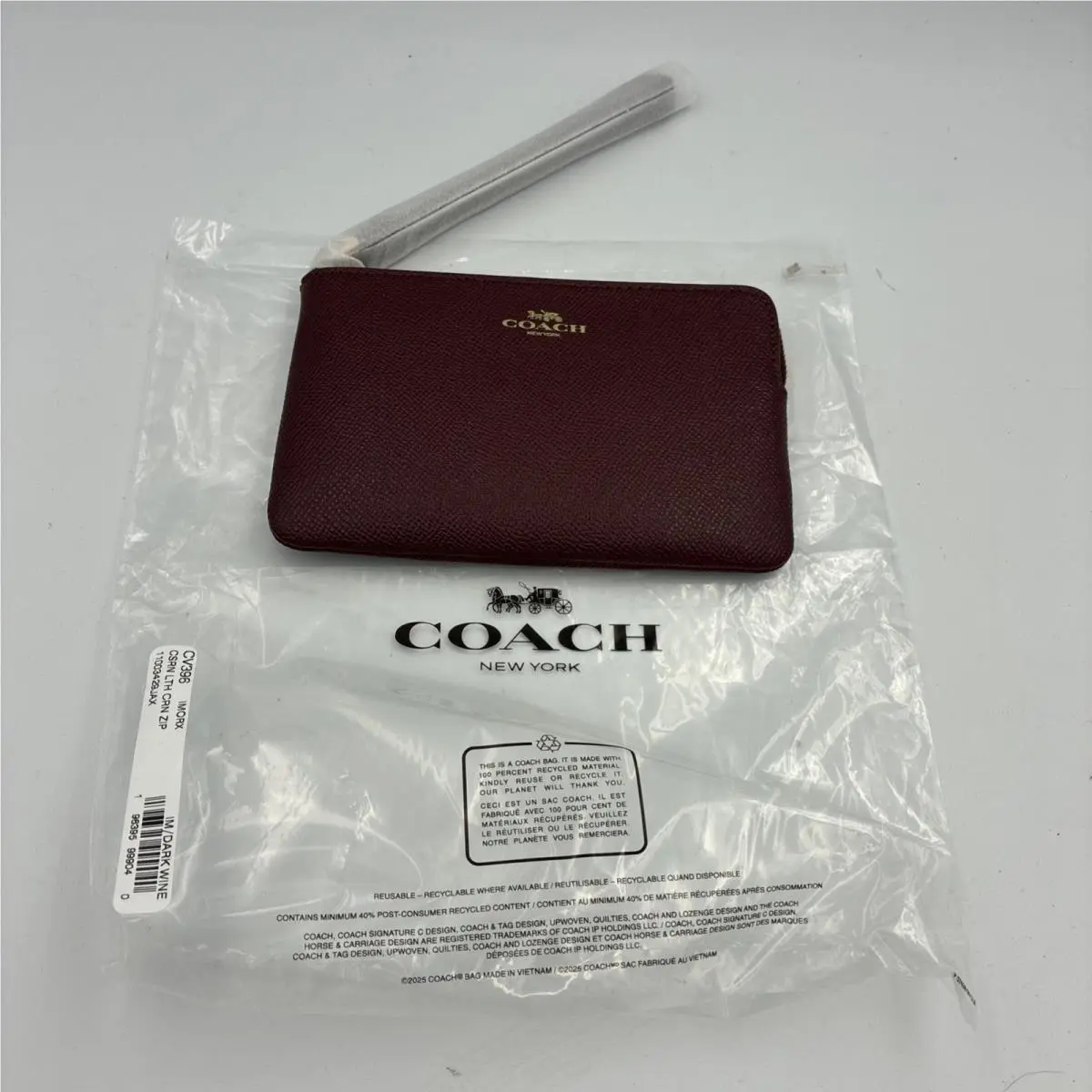 Coach Corner Zip Wristlet In Dark Wine