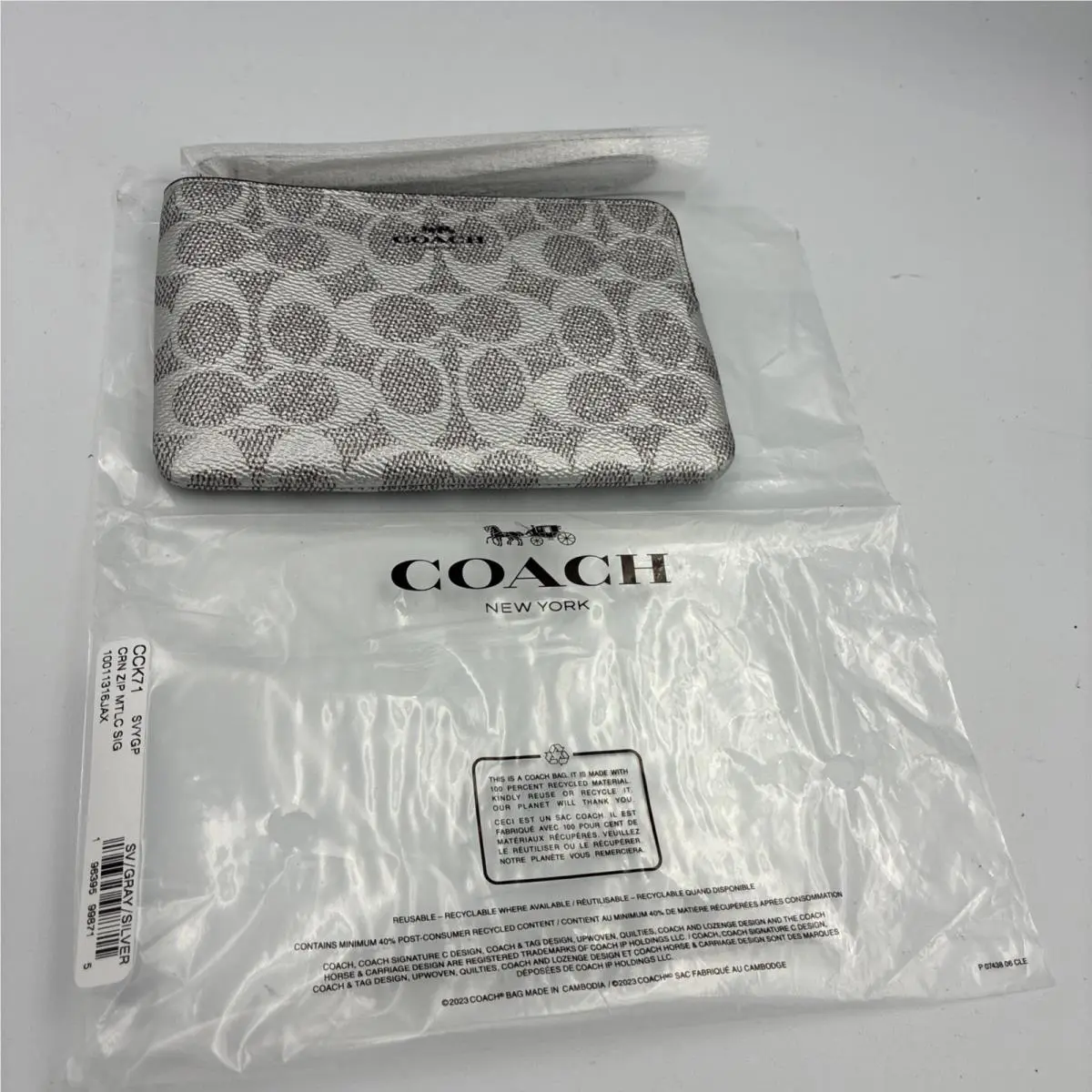 Coach Corner Zip Wristlet For Women - Silver/gray CCK71