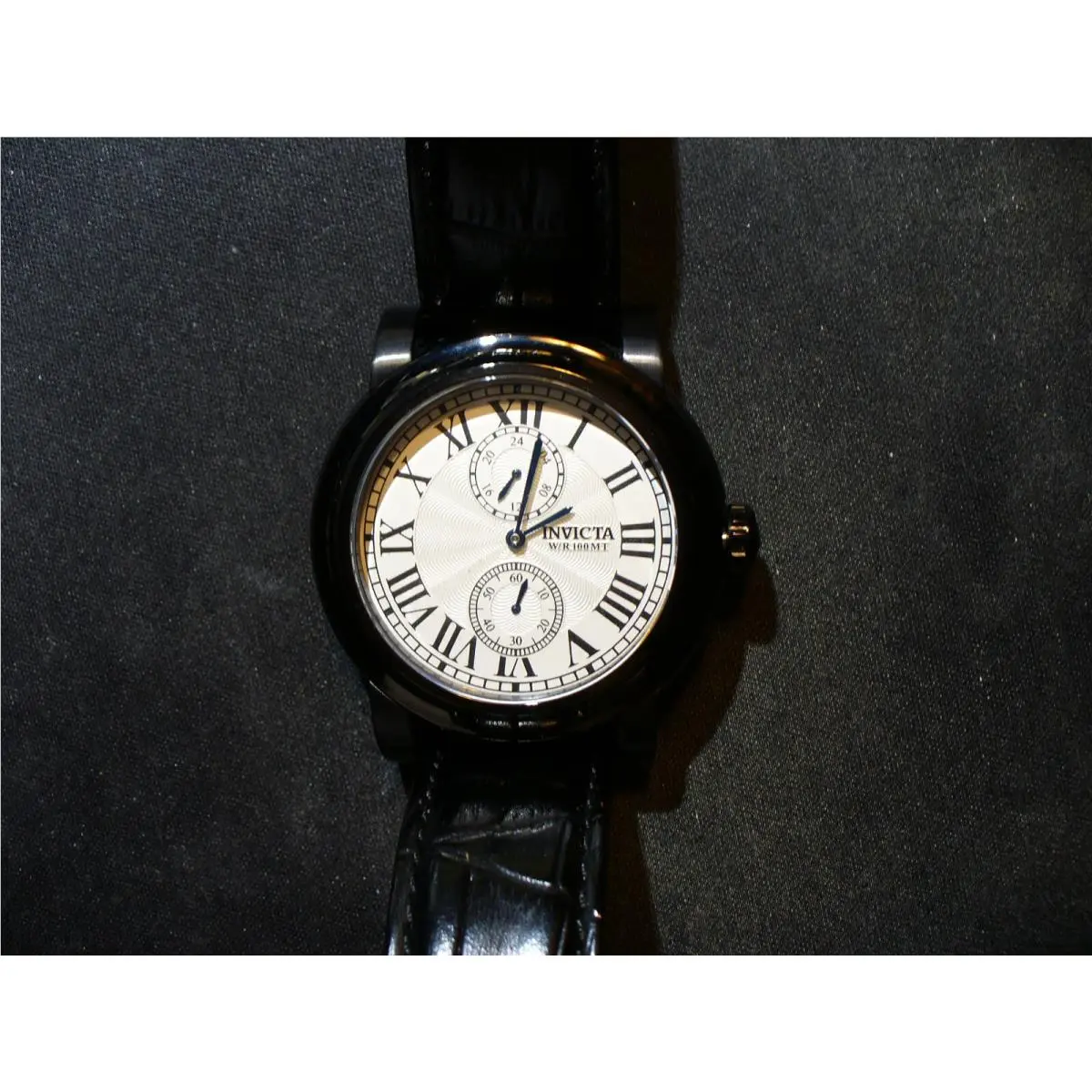 Multi Function Roman Numeral Textured Dial Black Quartz Watch by Invicta