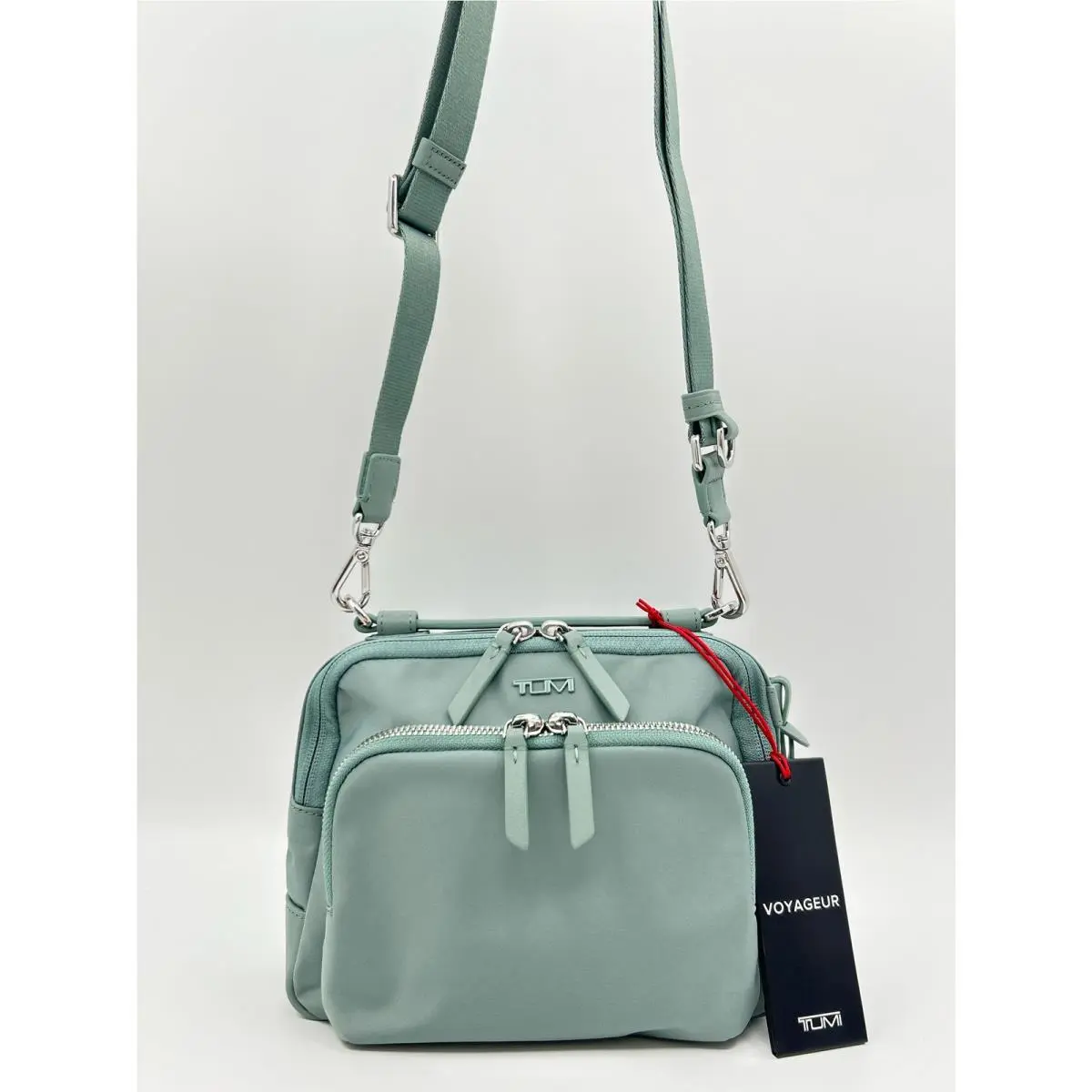 Tumi Teghan Crossbody Purse Light Blue Green Nylon Pockets Adjustable Women