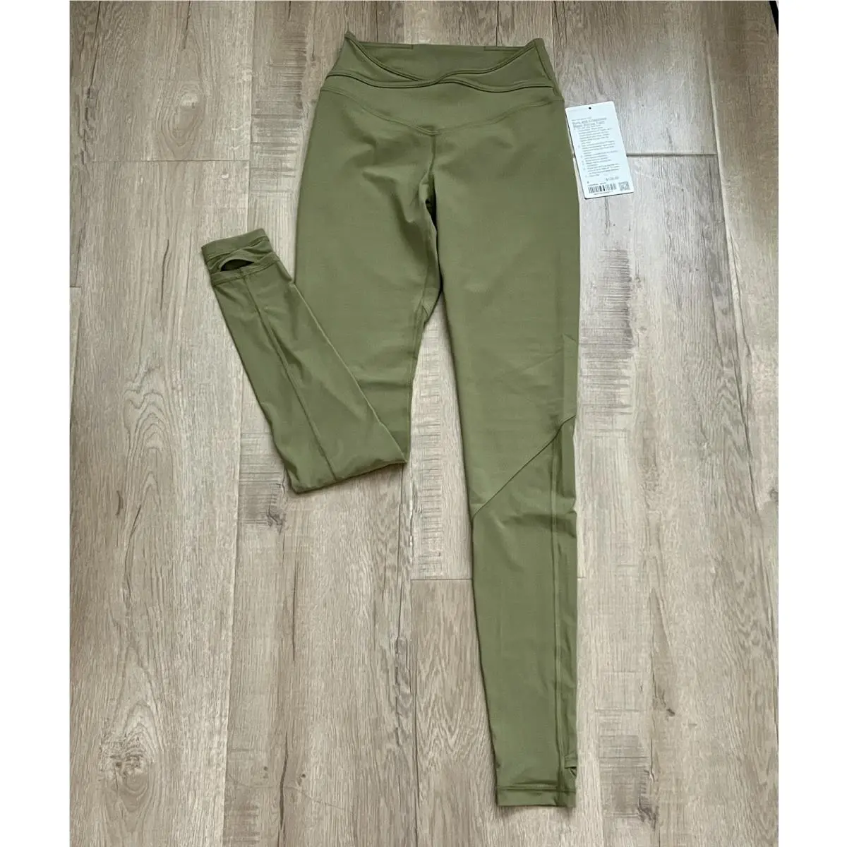 Lululemon Nulu and Crisscross Mesh Stirrup Tight Bronze Green Size 4