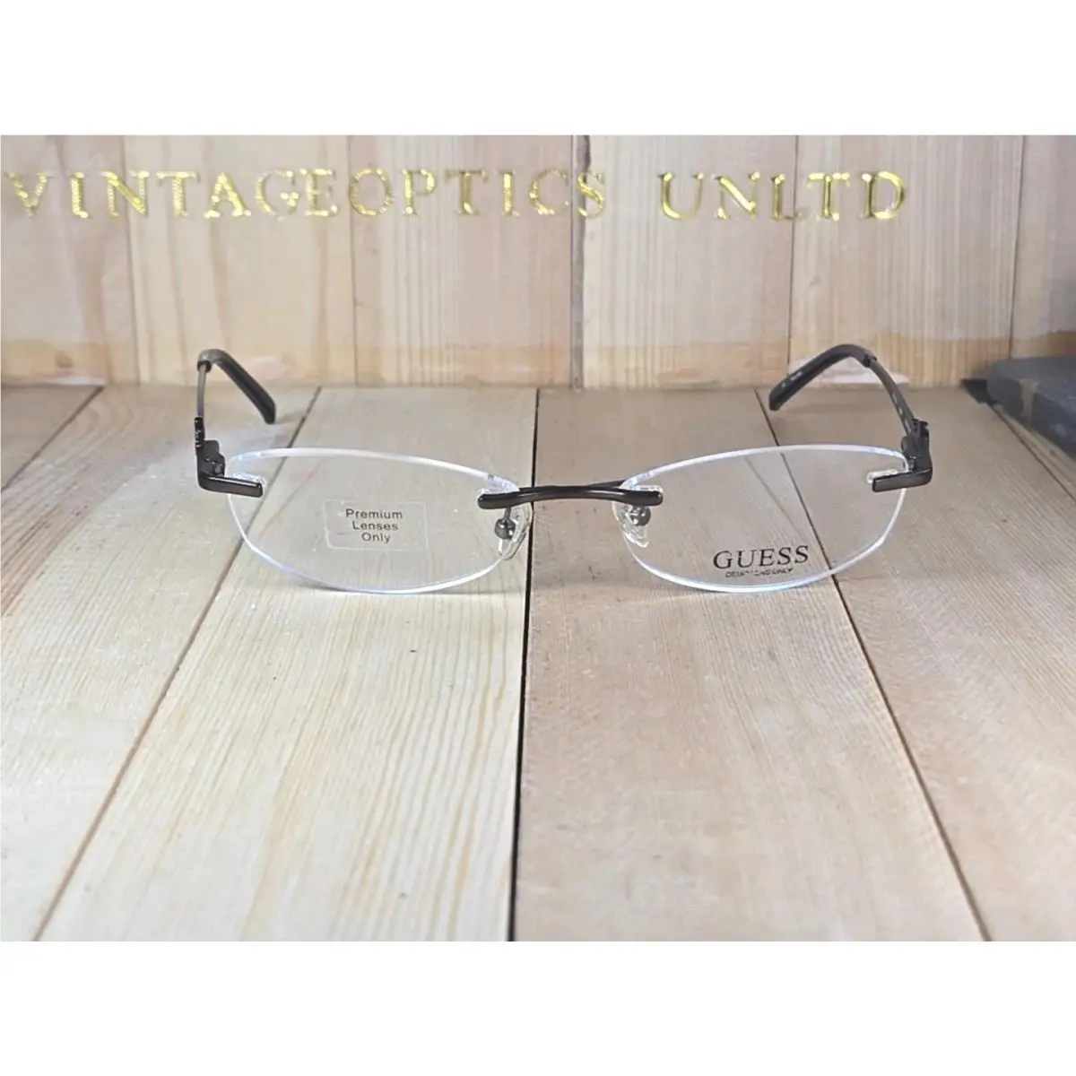 Model GU 2276 Brn Rimless Titanium Eyeglasses Frame by Guess