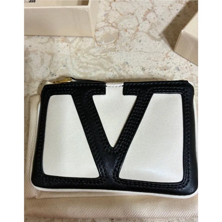 Garavani Viva Superstar Raffia Pouch Orig by Valentino