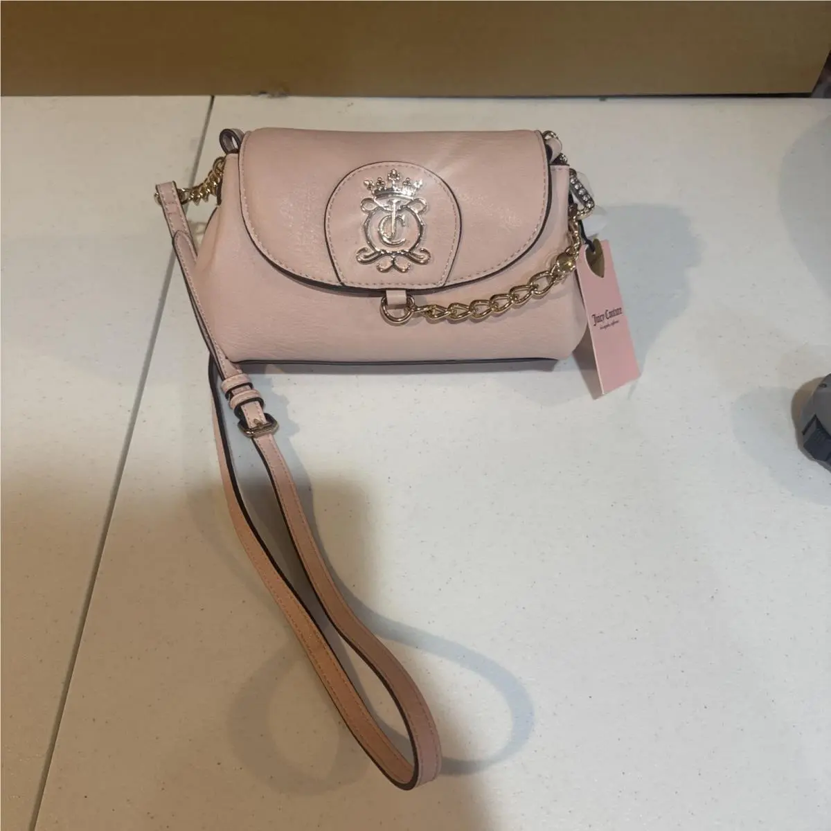 Royal Crest Crossbody Bag in Clay Pink by Juicy Couture