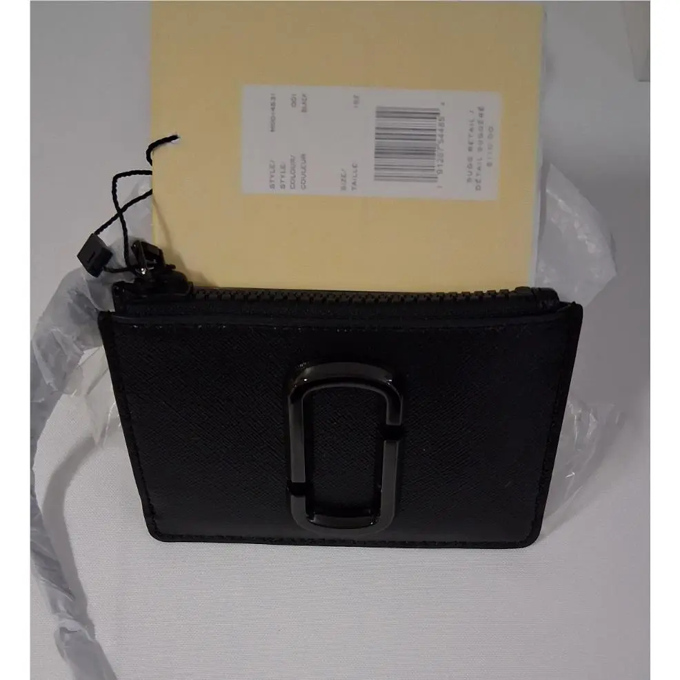 The  M0014531 is The Snapshot Dtm Top Zip Multi Wallet by Marc Jacobs