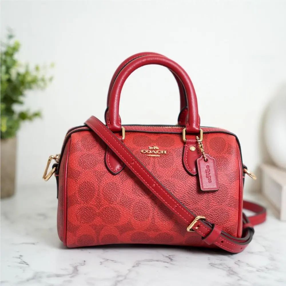 CEY63 Mini Rowan Crossbody Bag In Signature Canvas Gold/crimson by Coach
