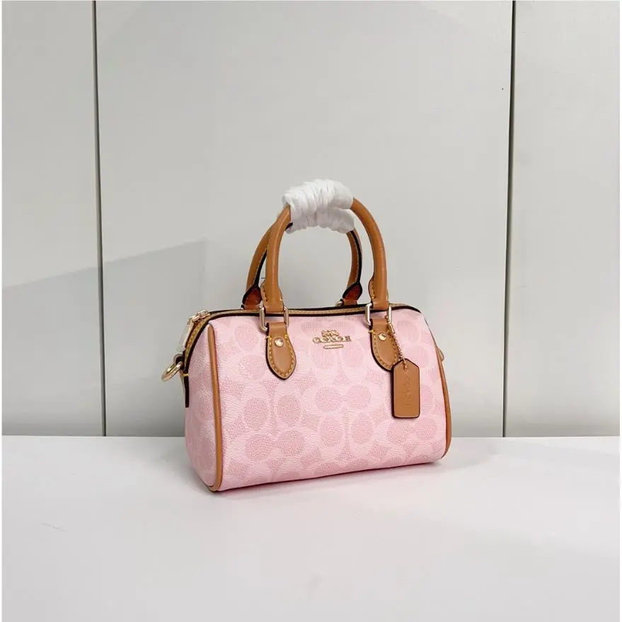 CEK79 Mini Rowan Crossbody Bag In Signature Canvas Powder Pink Brown by Coach
