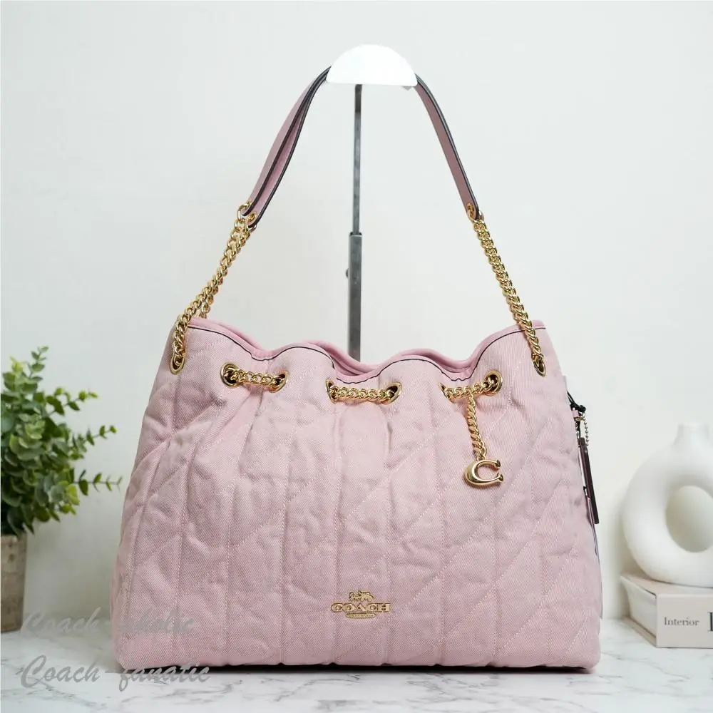 CER79 Evelyn Shoulder Bag In Loved Denim with Quilting and Charm by Coach
