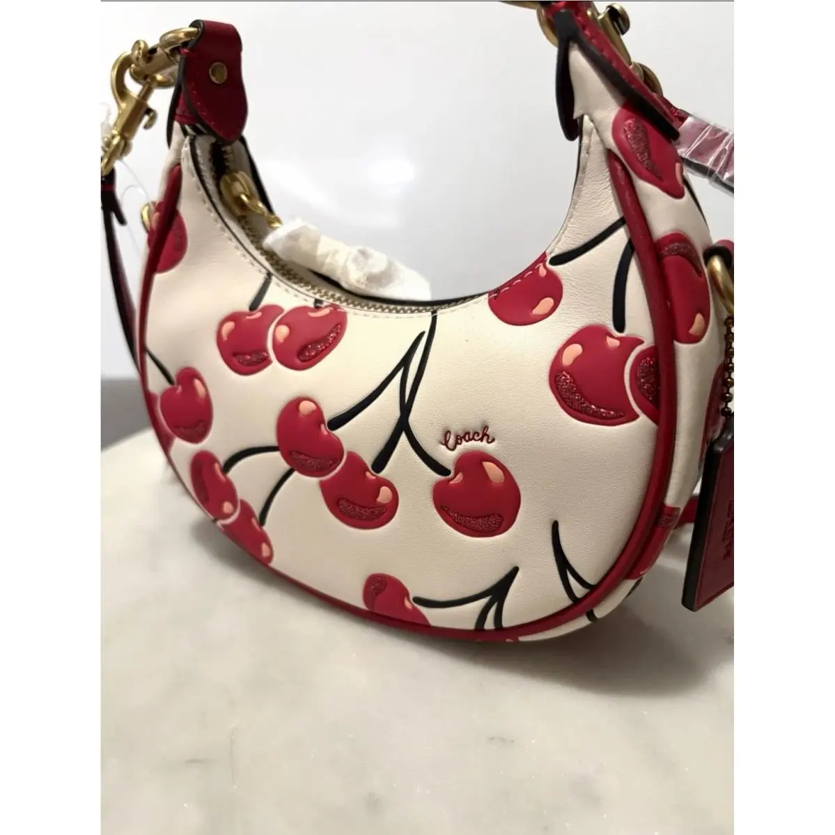 Jonie Cherry White Background Leather Bag Red Strap Small Size by Coach