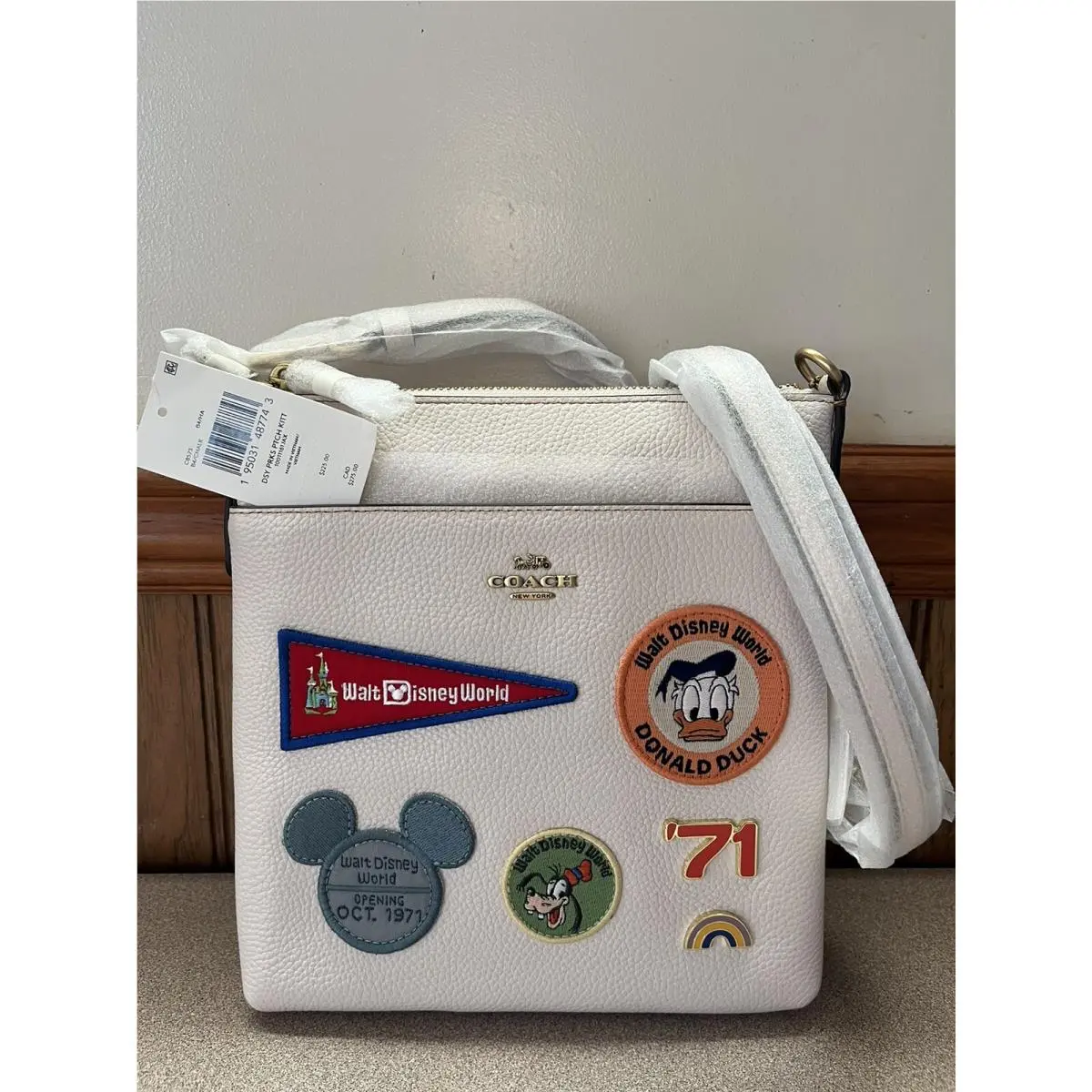 x Disney Kitt Messenger Crossbody with Patches Brass Chalk by Coach