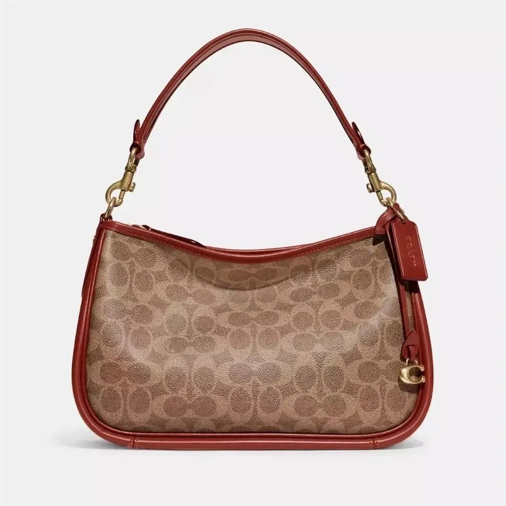 Cary Crossbody Bag In Signature Canvas in Tan/rust by Coach
