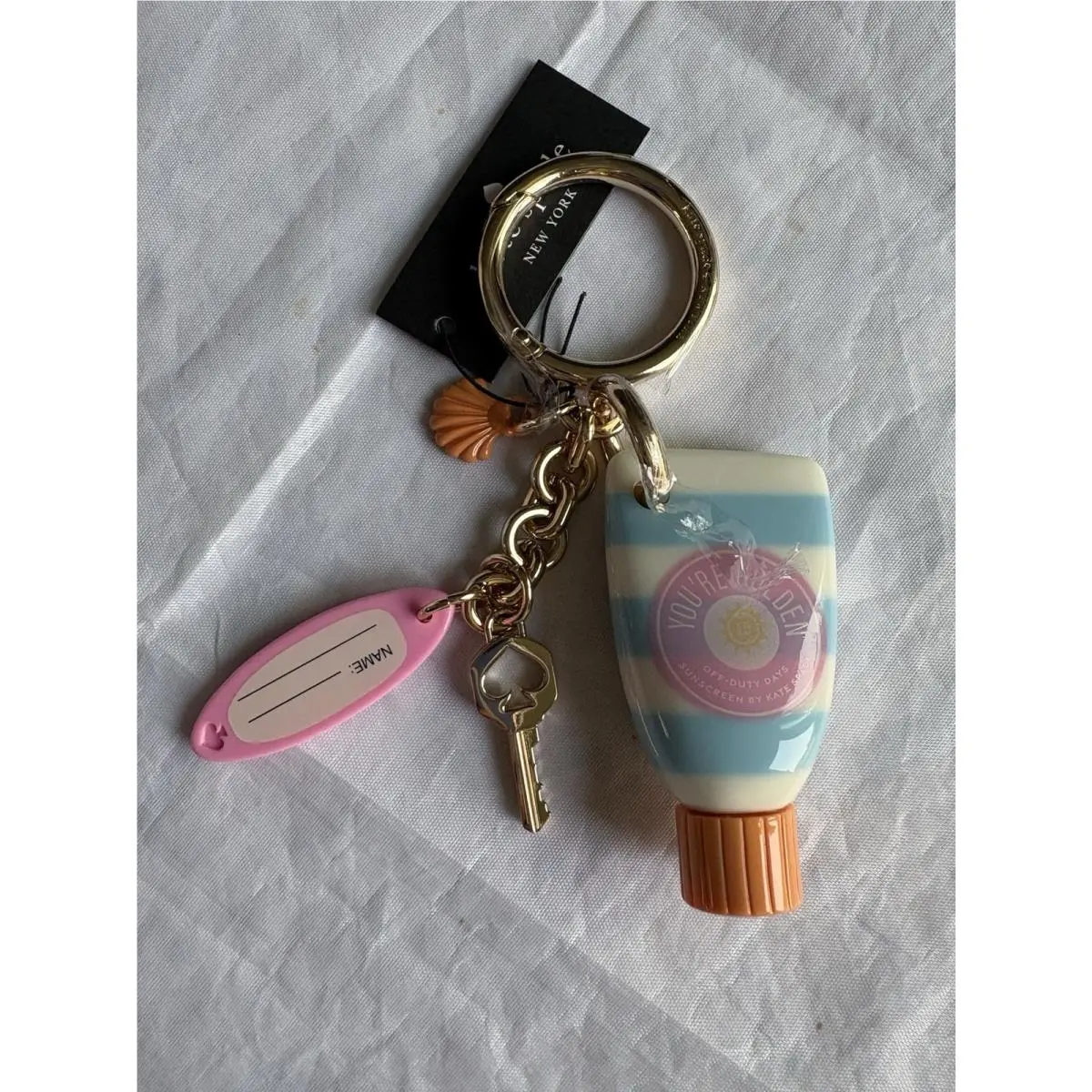 Charmed Sunscreen Bag Charm/key Ring KP086 by Kate Spade
