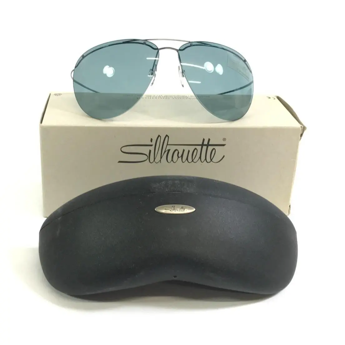 Sunglasses M8576 /45 V6075 Blue Rimless Frames w/ Light Gray Lenses by Silhouette