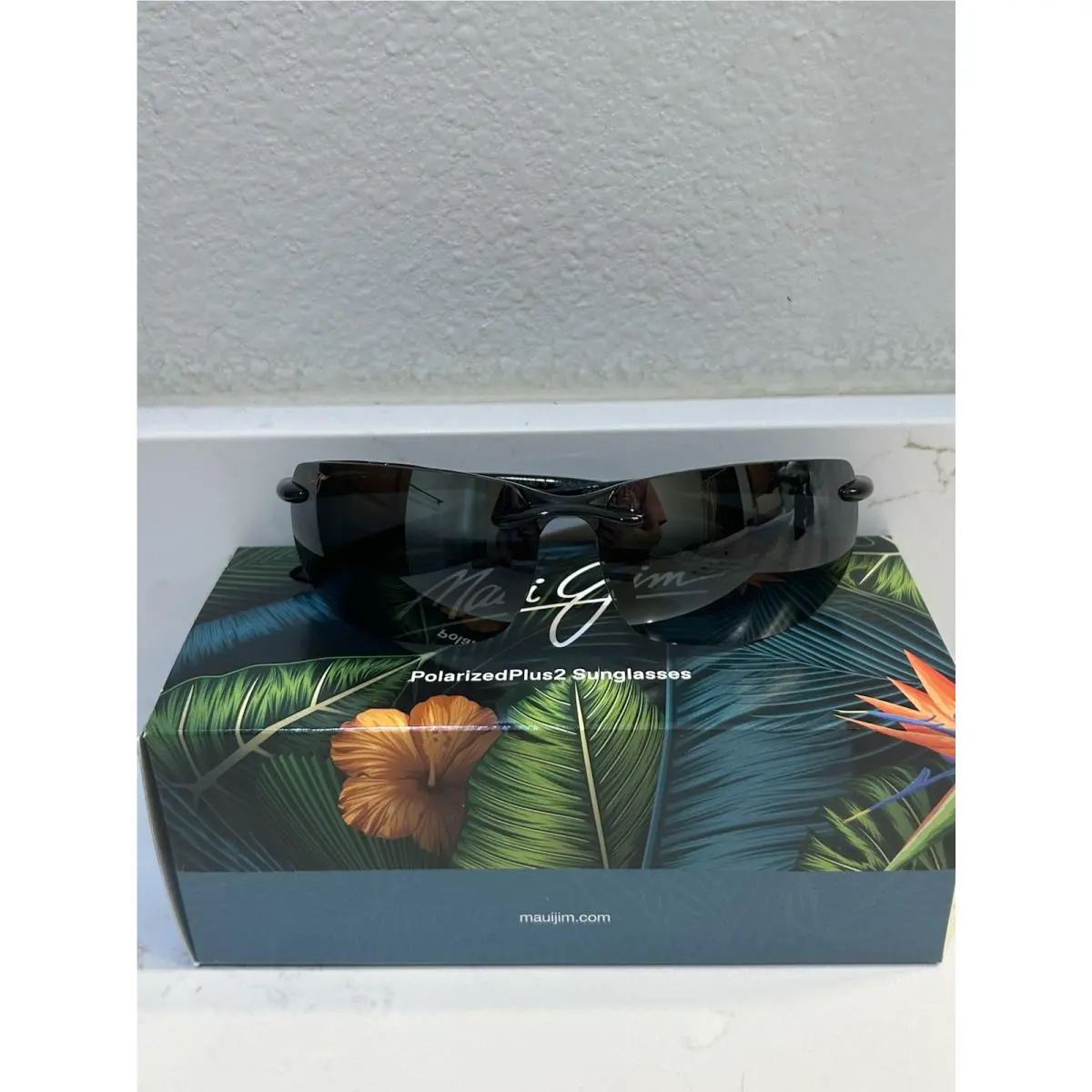 Unisex Banyans Gloss Black Rimless Wraparound Sunglasses by Maui Jim