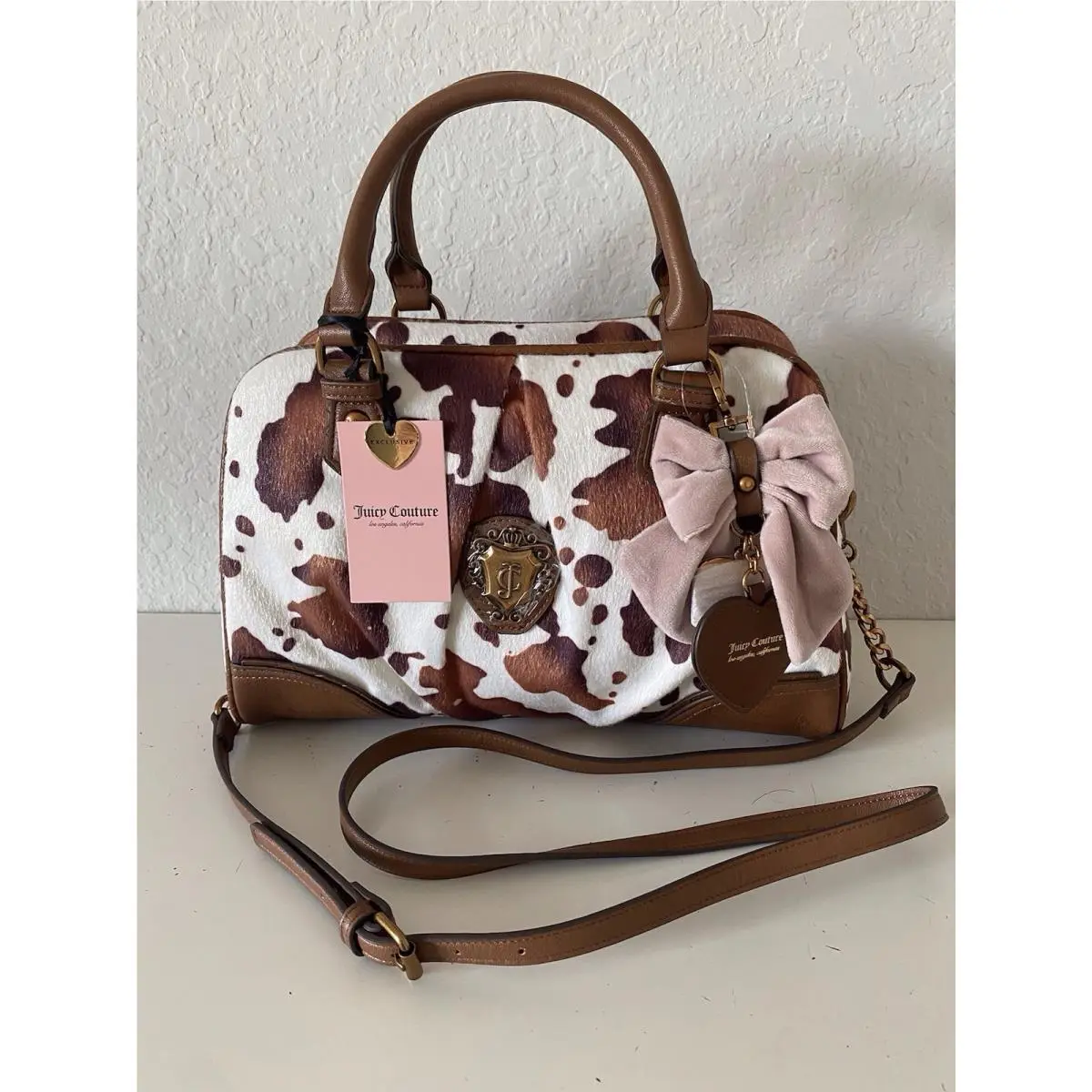 Romance Cow Print Satchel In Saddle Brown W/charm Viral by Juicy Couture