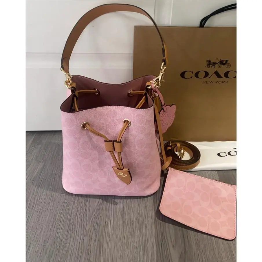 Coach CEA23 Rowan Bucket Bag In Signature Canvas with Charms Powder Pink