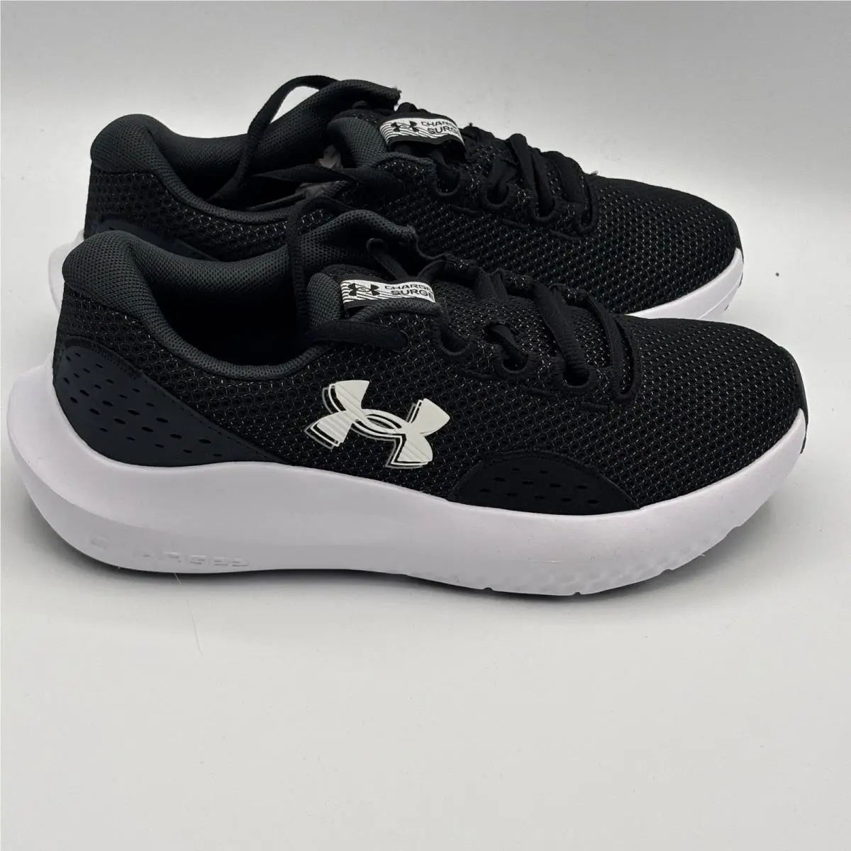 Under Armour UA Charged Surge 4 Shoes Womens Size 6.5 Black White 3027007-001