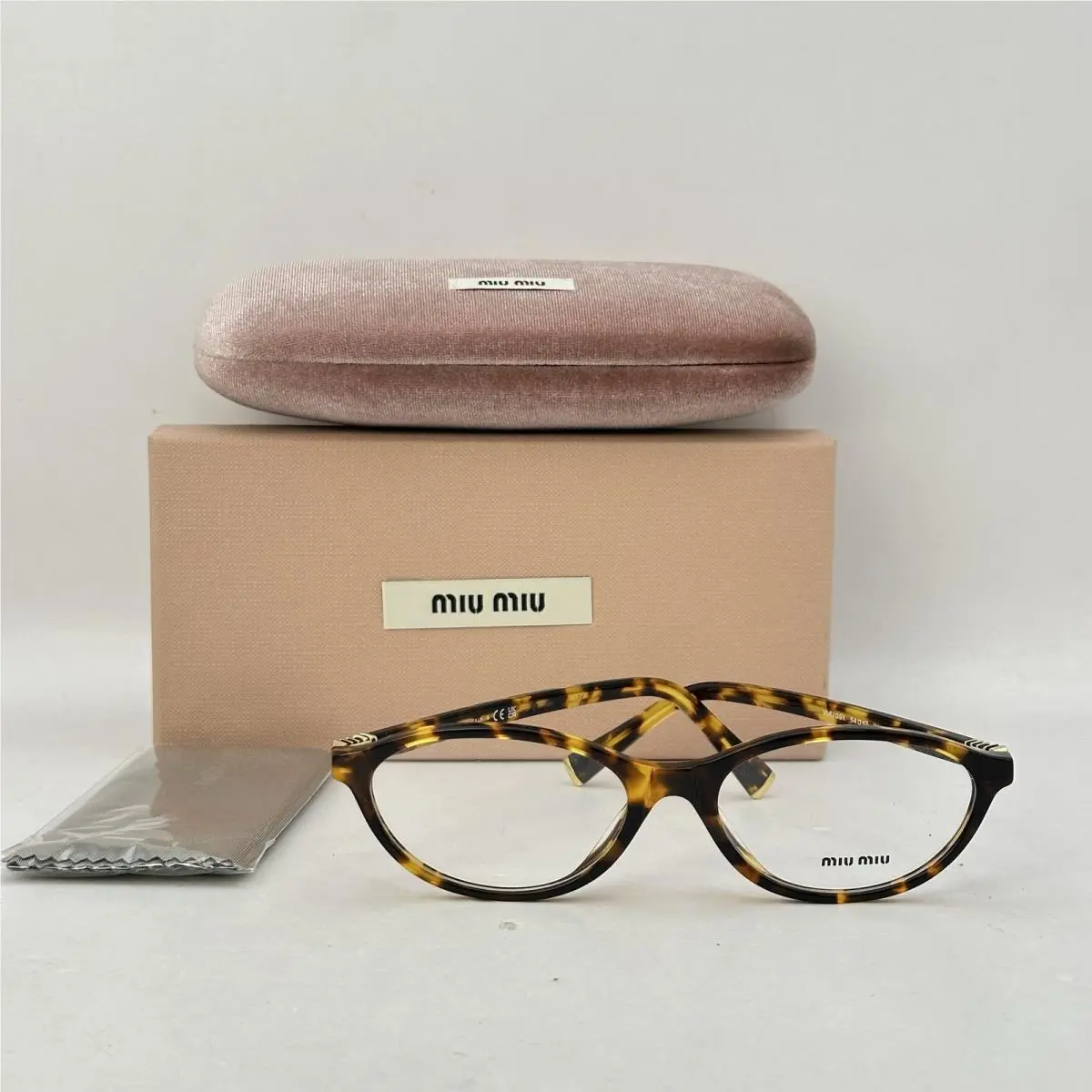 Miu Miu Womens Narrow Oval Thin Acetate Eyeglasses MU09XV Honey Havana