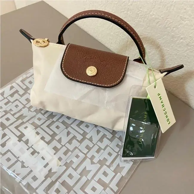 Longchamp Le Pliage Pouch with Handle Ecru Off White L34175089337
