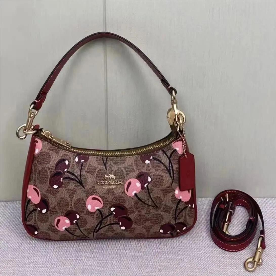 Teri Shoulder Bag In Signature Canvas in Multiple Colors Cherry by Coach