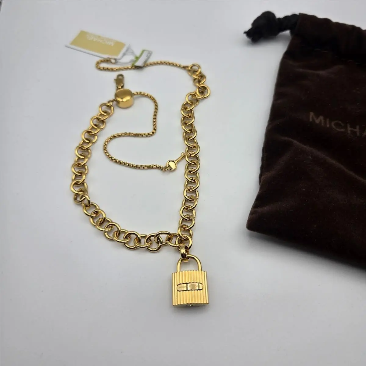Michael Kors Gold-tone Chain Bracelet with Lock Pendant Velvet Pouch