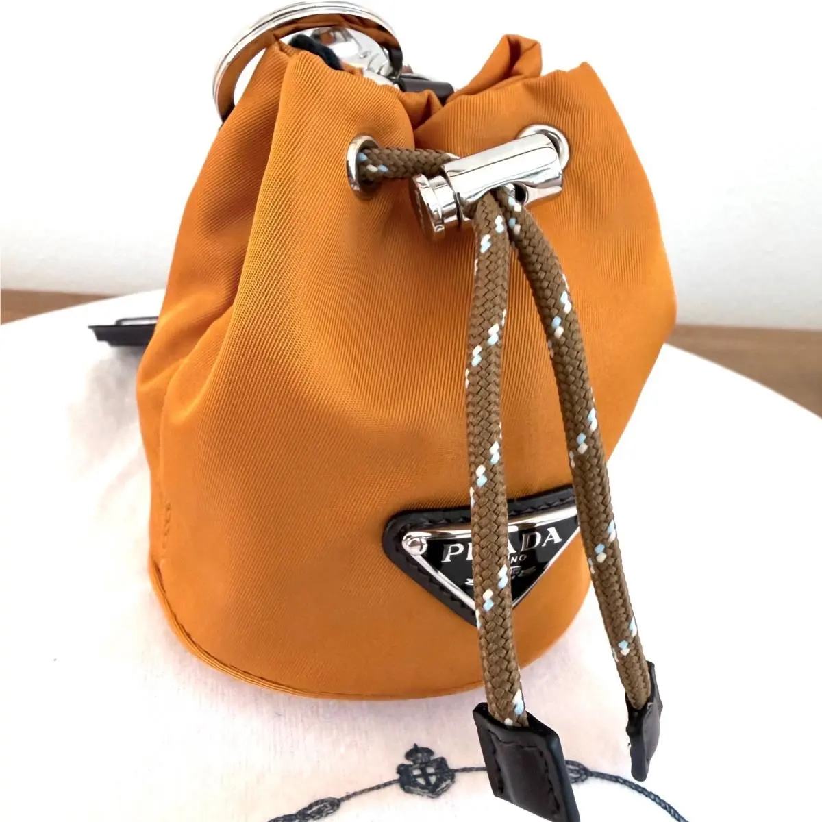 Prada Ambra Orange Tessuto Nylon Mini Drawstring Pouch Bag Charm 1TT202