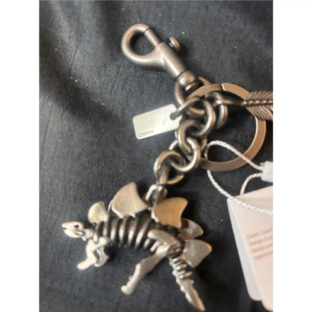 Coach Stegosaurus Skeleton Dinosaur Feather Key Chain Bag Charm