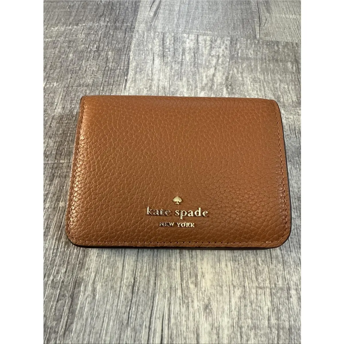 Kate Spade Kayla Pebbled Leather Small Bifold Wallet Brown