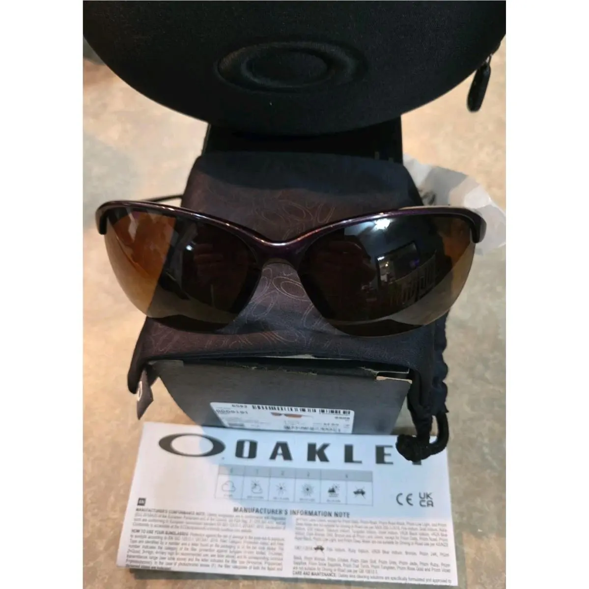 9191-9908 Raspberry Brown Gradient Polarized Women`s 65mm Sunglasses by Oakley