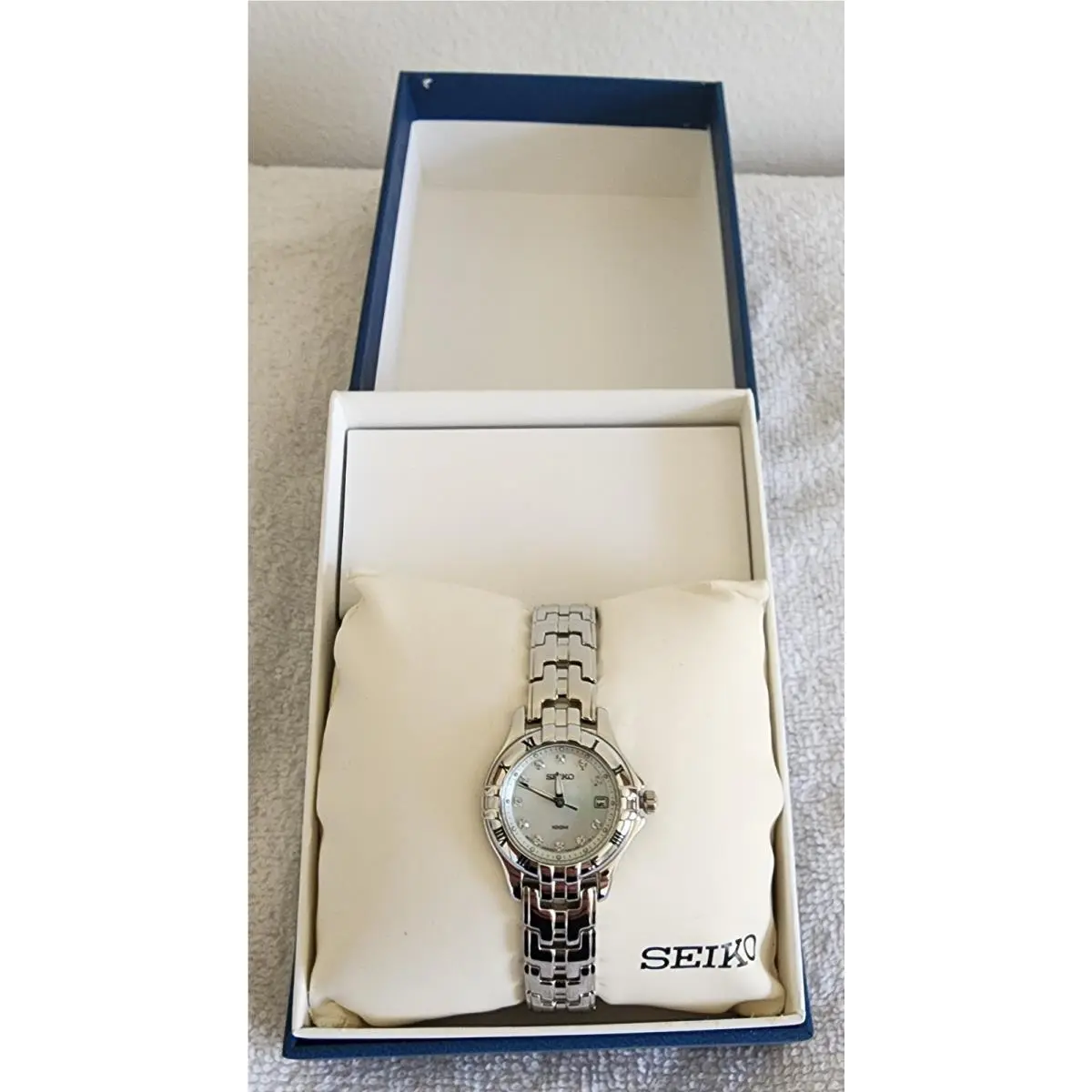 Women`s Silver Tone Quartz Watch Roman Numeral Bezel 100M Date Box by Seiko