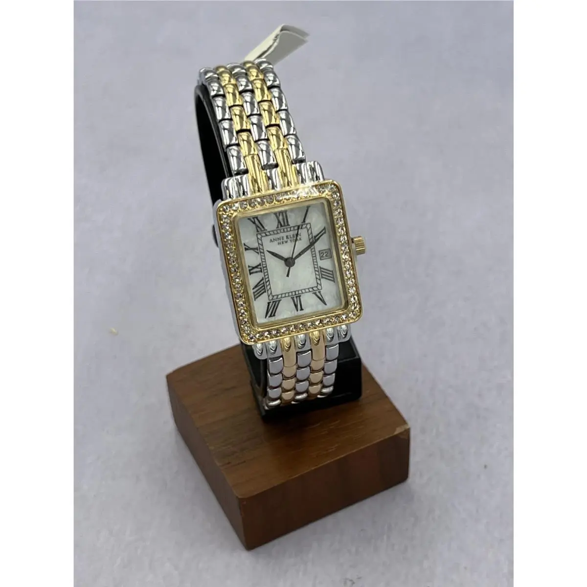 12/2347MPTT Women`s Diamond Accented Mop Dial Analog Bracelet Watch by Anne Klein