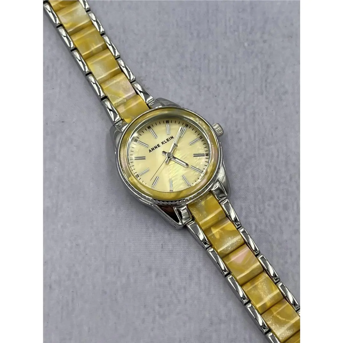 AK/3213G Women`s Yellow Dial Silver Case Analog Bracelet Watch by Anne Klein