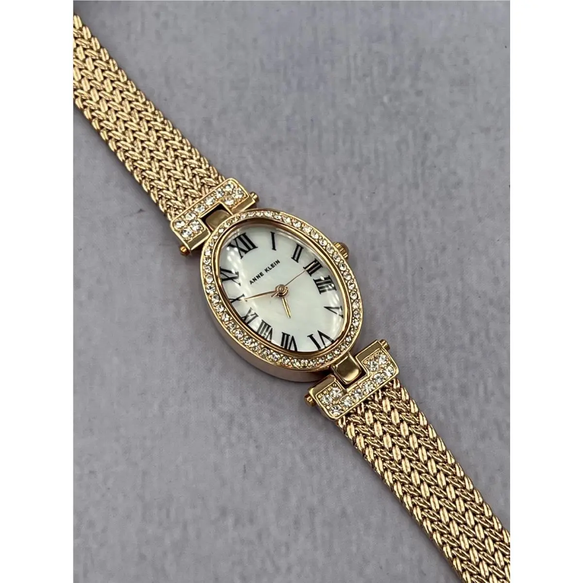 AK/4022 Women`s Diamond Accented Rose Gold Mesh Bracelet Analog Watch by Anne Klein