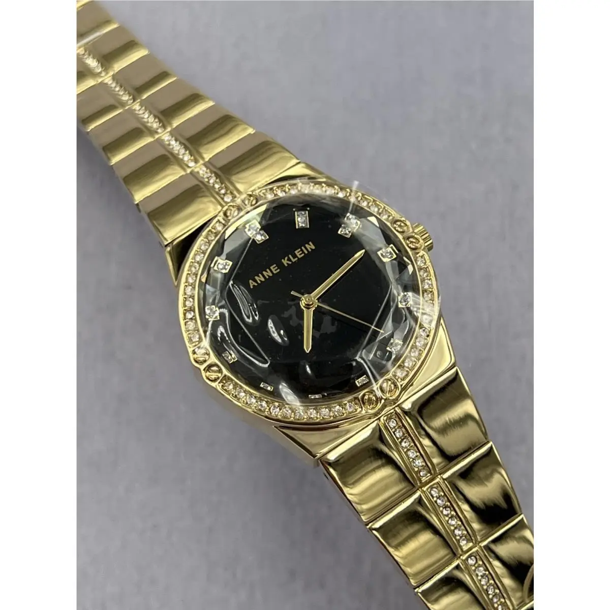 AK/5036 Women`s Diamond Accented Gold Case Analog Bracelet Watch by Anne Klein
