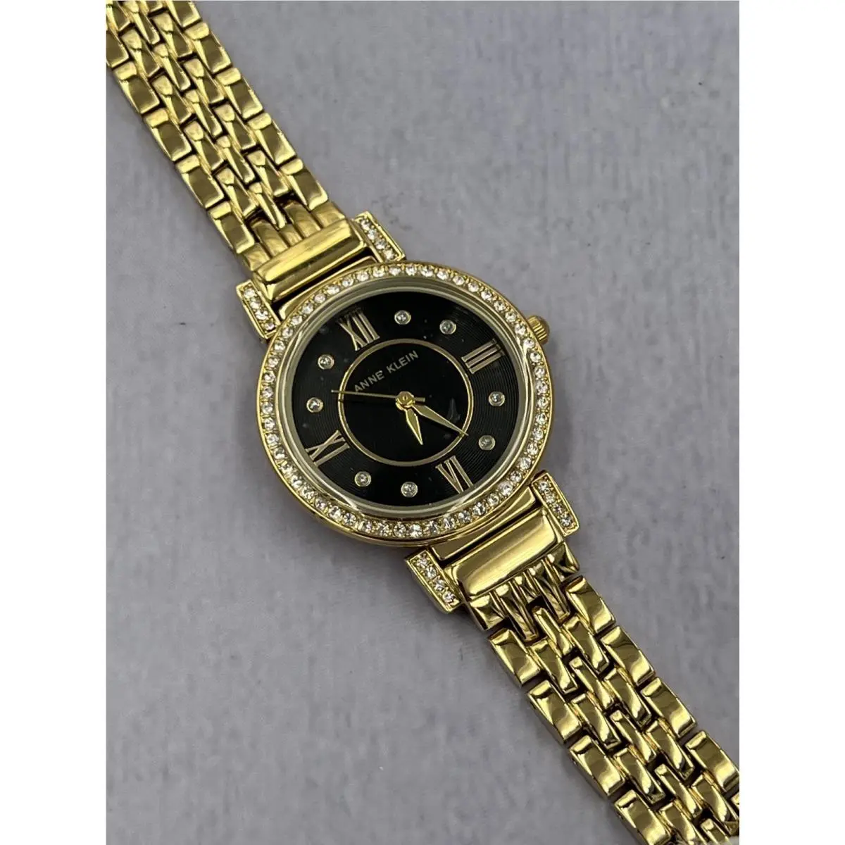 AK/2928G Women`s Diamond Accented Gold Case Analog Bracelet Watch by Anne Klein