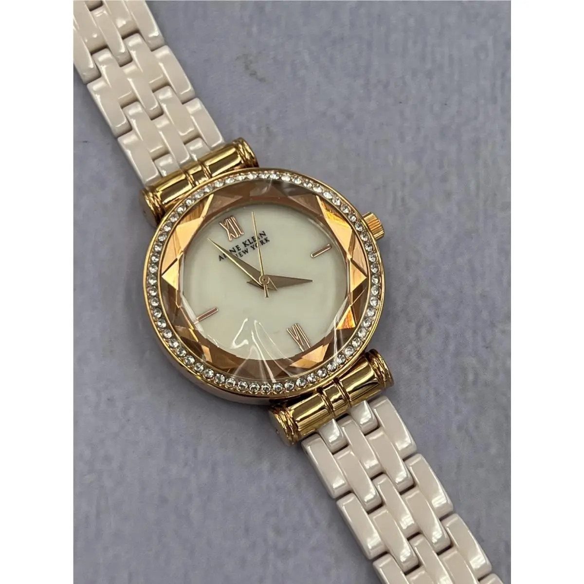 12/2316RGST Women`s Diamond Accented Mop Dial Analog Bracelet Watch by Anne Klein