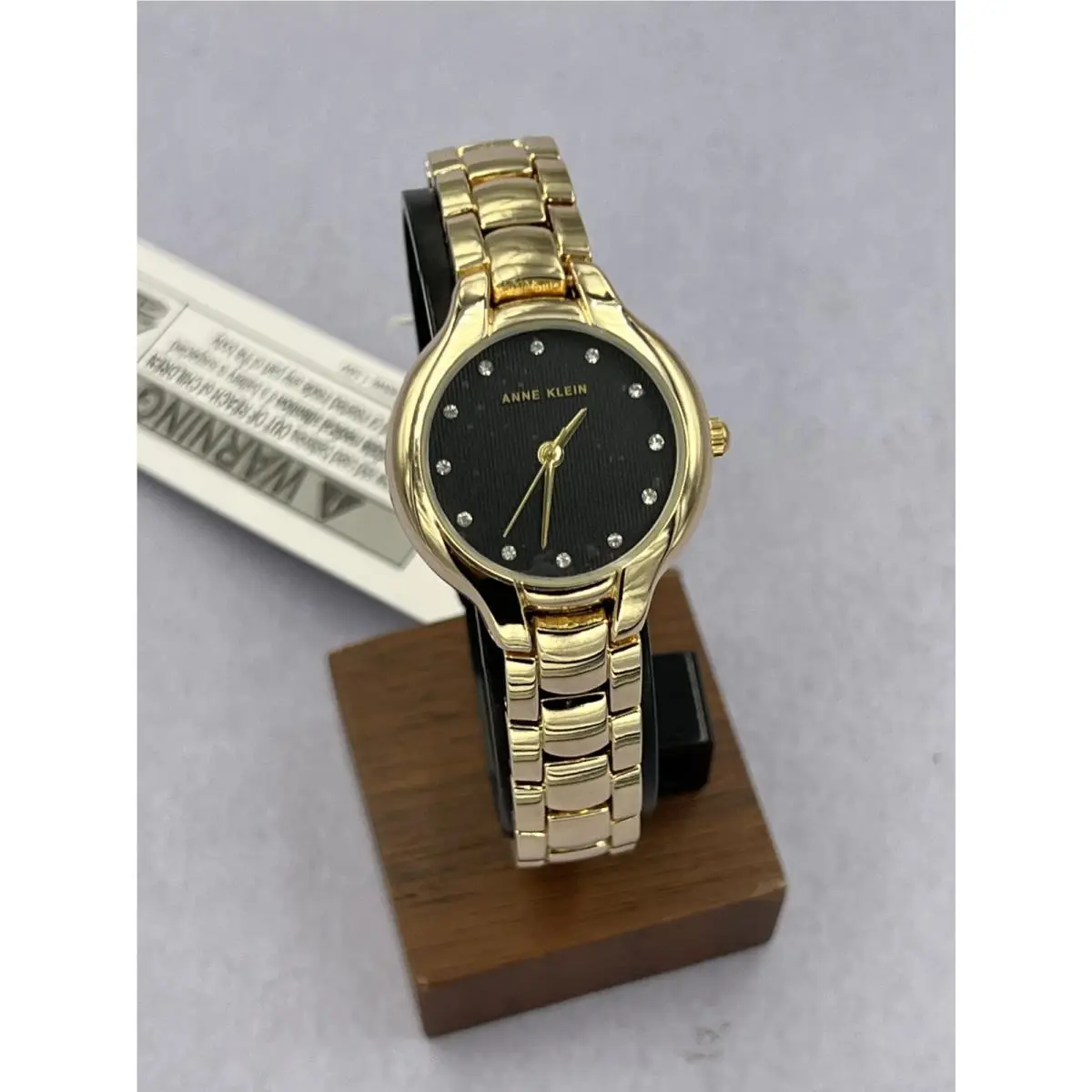 AK/5292BKGBST Women`s Diamond Accented Gold Analog Bracelet Watch by Anne Klein