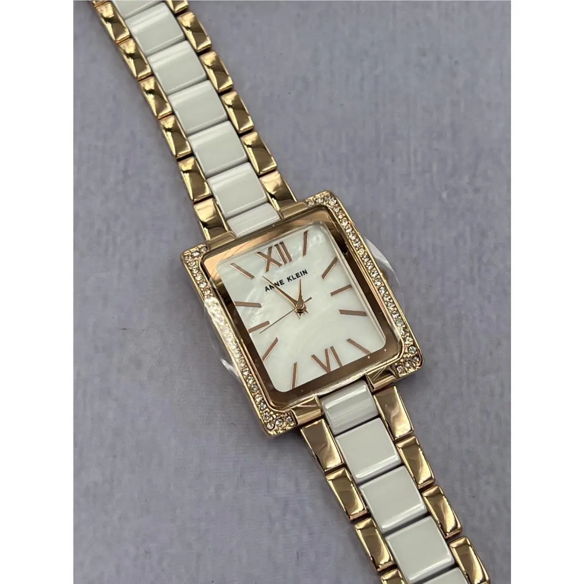 AK/4046WTST Women`s Diamond Accented Mop Dial Analog Bracelet Watch by Anne Klein