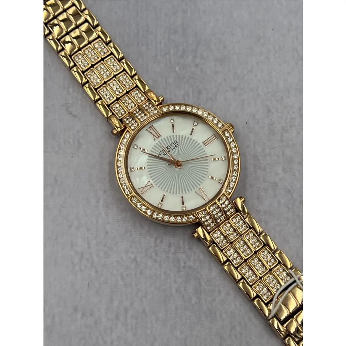 12/2286MPRG Women`s Diamond Accented Mop Dial Analog Bracelet Watch by Anne Klein