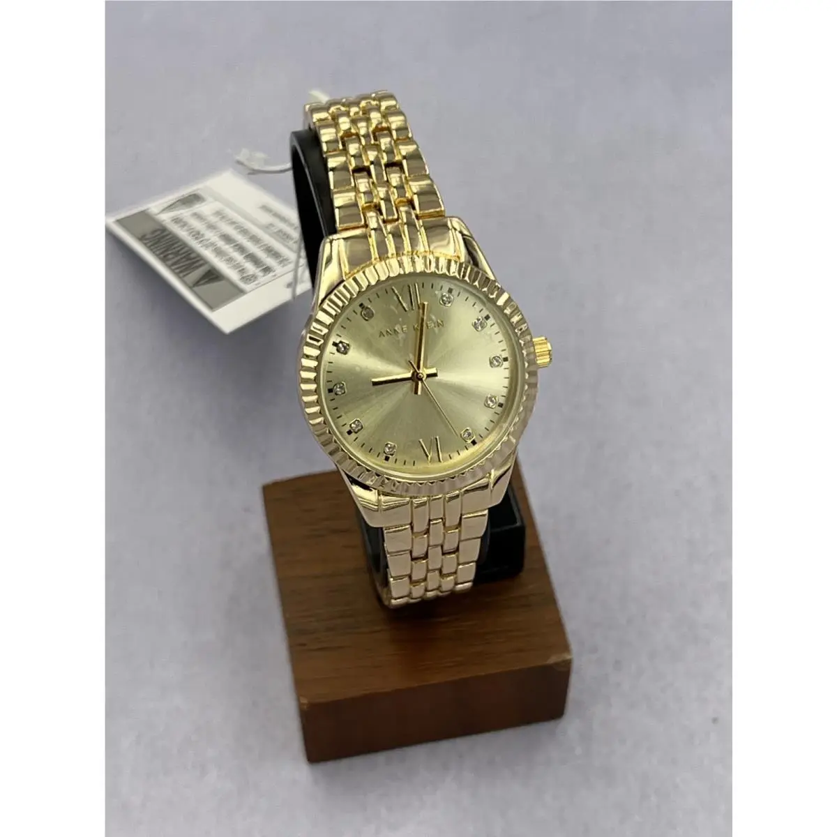 AK/5336CHGBST Women`s Diamond Accented Gold Dial Case Analog Watch by Anne Klein